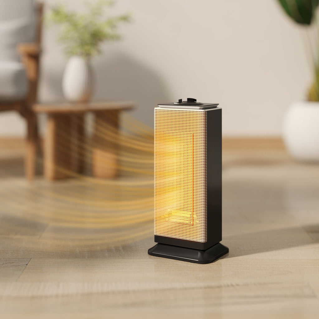 Black ceramic electric space heater with glowing heating element on floor