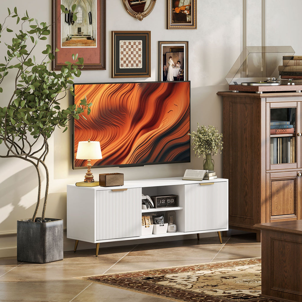 White TV stand cabinet with ribbed doors and open middle shelf, set on gold angled legs