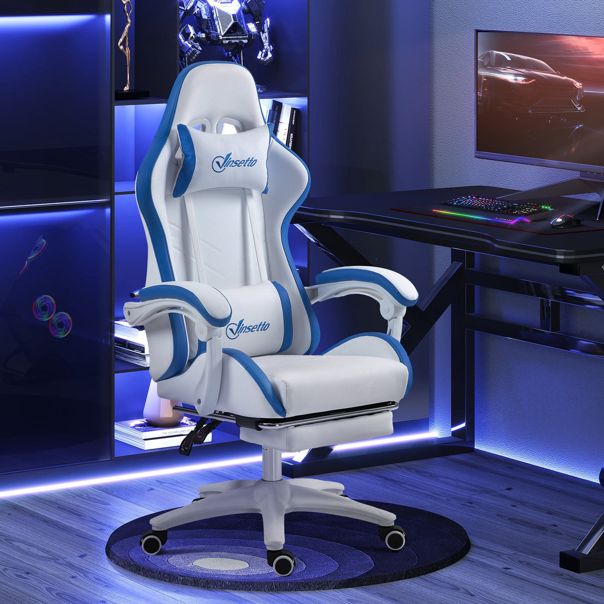 White and blue gaming chair with headrest, lumbar support, footrest, and swivel base