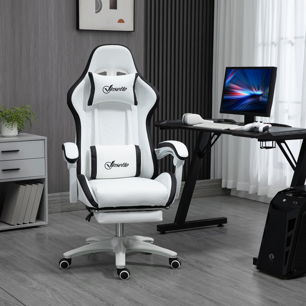 White-and-black gaming chair on wheeled base, reclined seat with footrest.