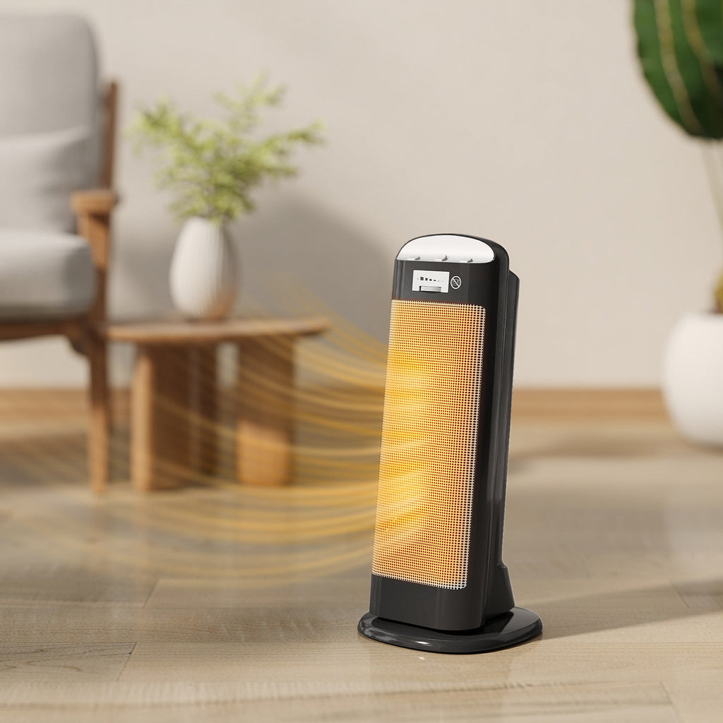 Black ceramic space heater with glowing heating element and top control panel