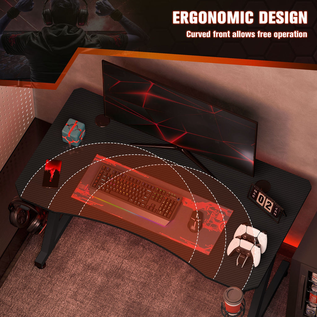 Black gaming desk with curved front edge for leg space and easy gaming setup