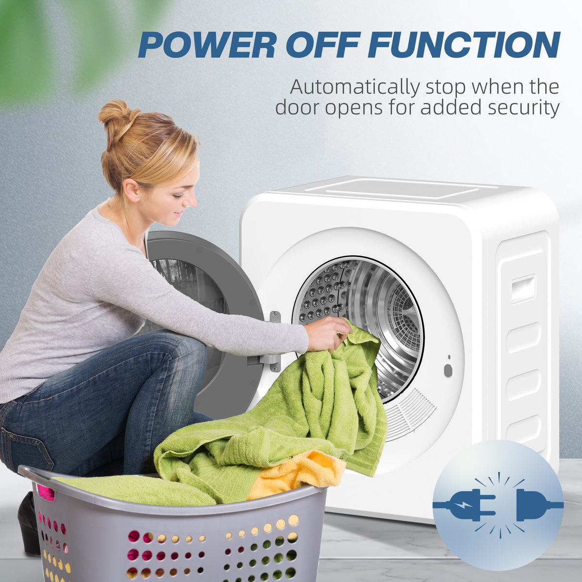 Person loading clothes into a white compact tumble dryer with round glass door