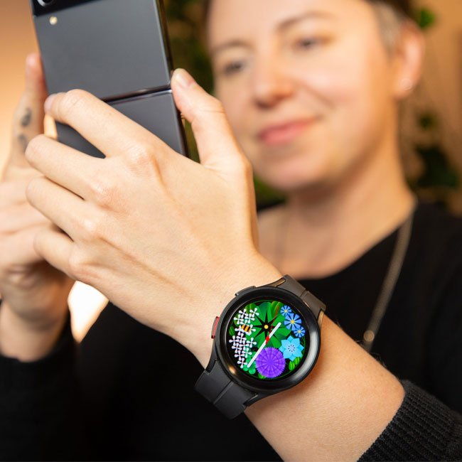 Samsung Galaxy Watch 5 Pro 45mm smartwatch on wrist, colorful app display, black strap