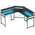 Black L-shaped work desk with LED light strips under the tabletop and frame