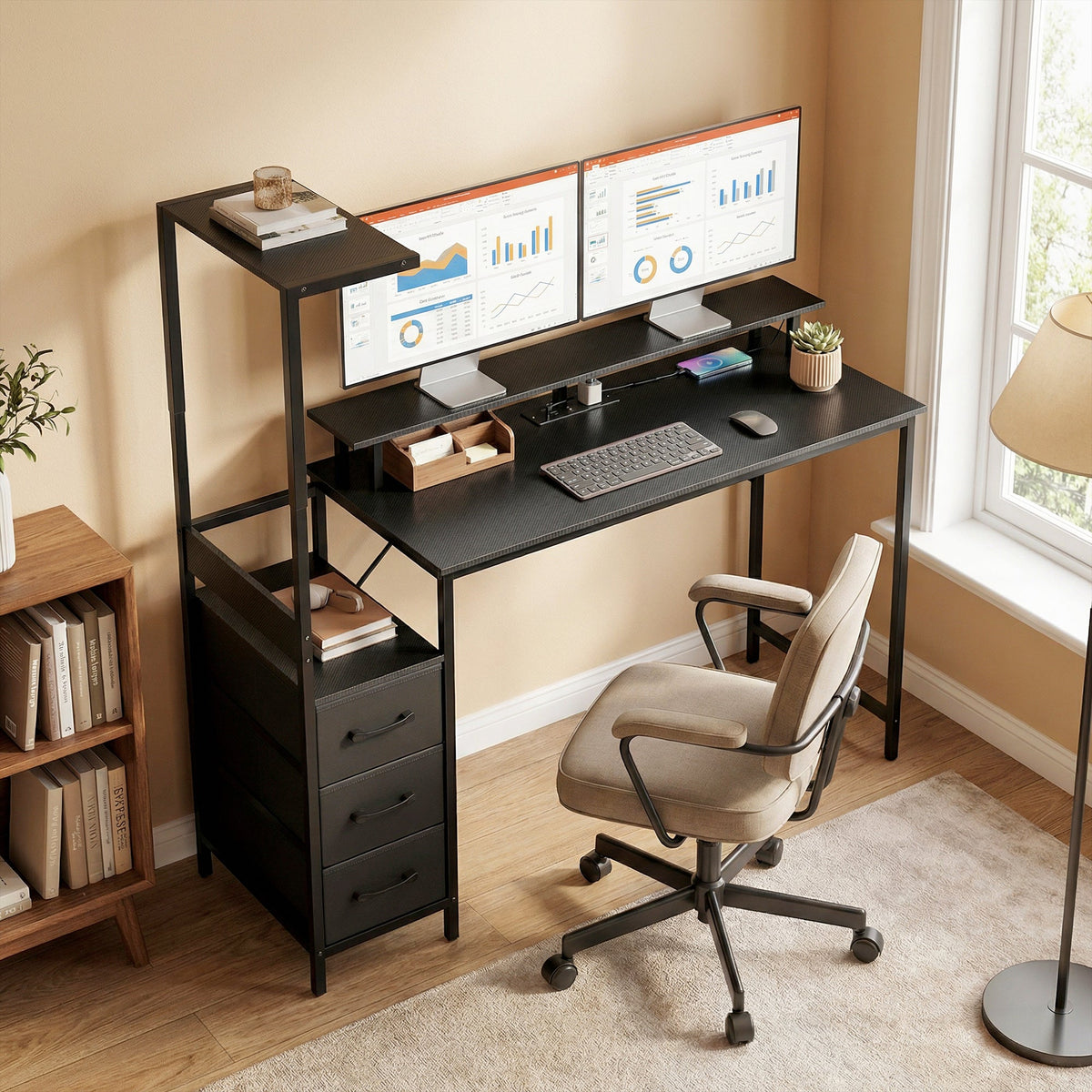Black gaming desk with dual monitor setup, keyboard tray, and side drawer cabinet