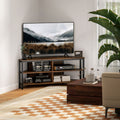 Rustic brown TV stand cabinet with open shelves and lower storage, black metal frame.
