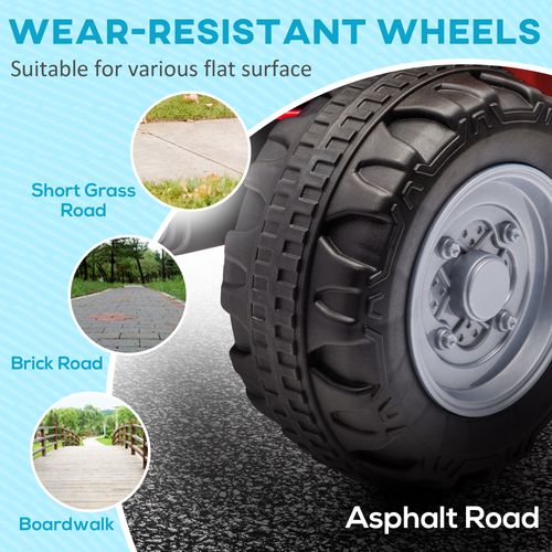 Red kids electric quad bike wheel close-up with deep black tread