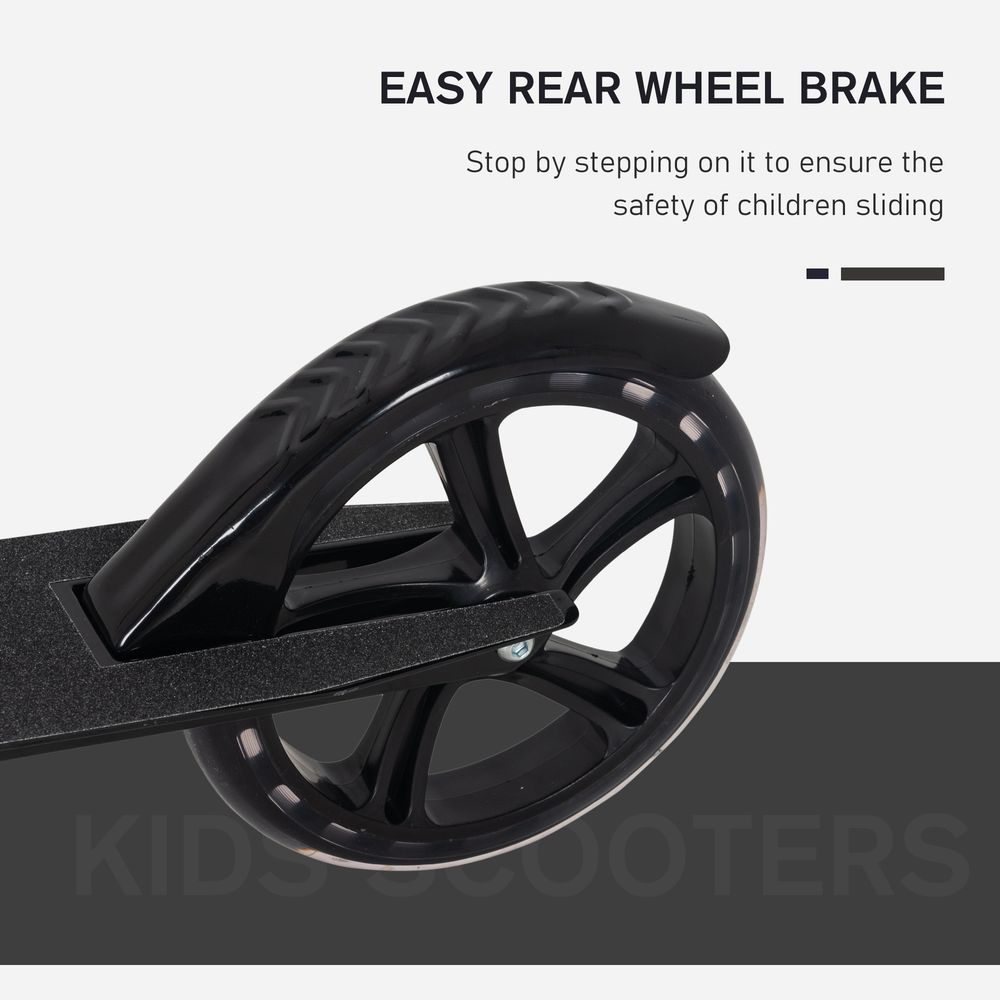 Close-up of black rear wheel and brake on a kids ride-on scooter