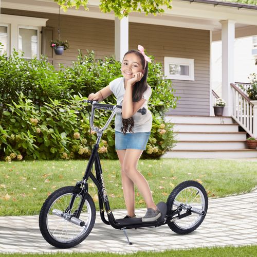 Black teen stunt scooter with curved deck and large front and rear 16 in wheels