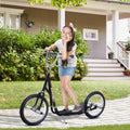 Black teen stunt scooter with curved deck and large front and rear 16 in wheels