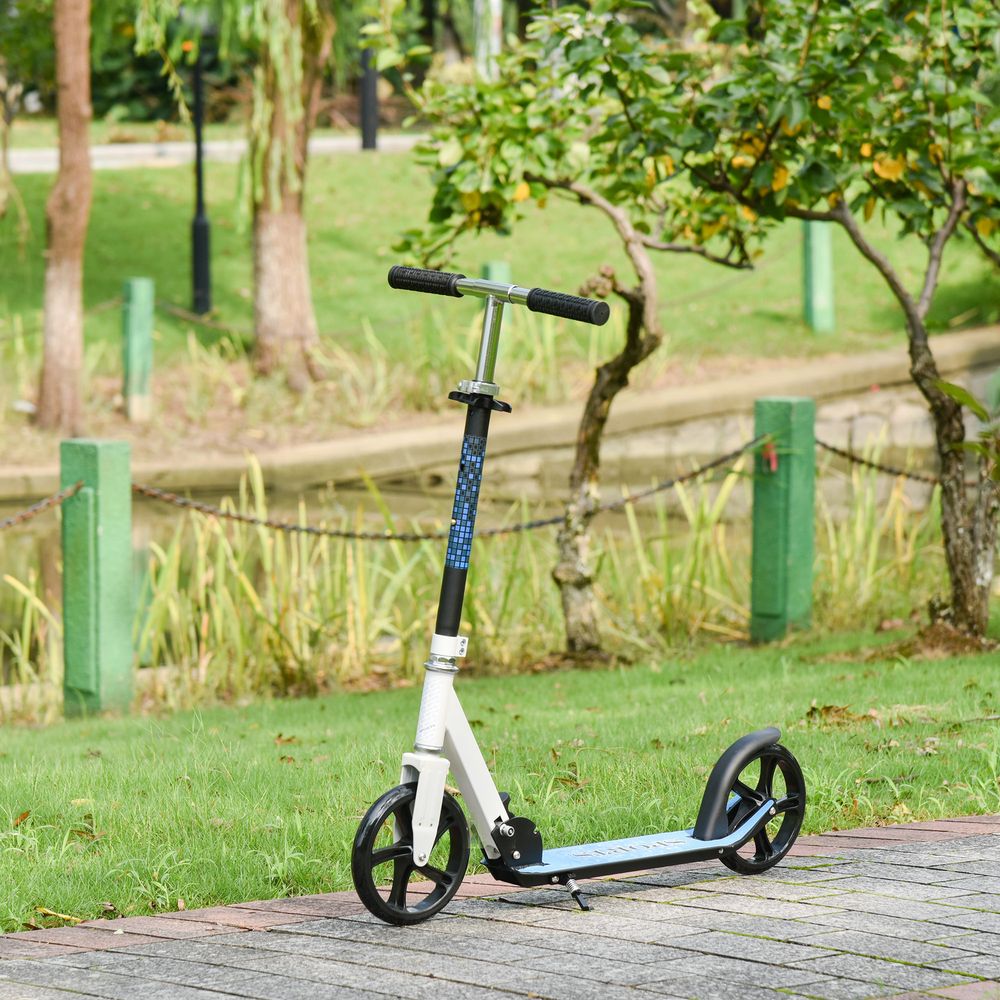 Foldable kick scooter with adjustable handle, white deck and black wheels.