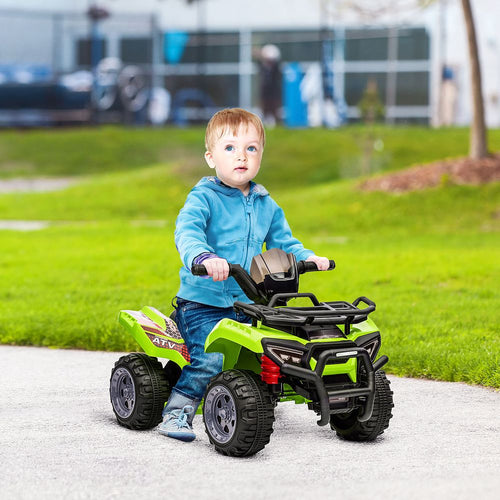 Child riding a lime green electric quad bike with black roll cage