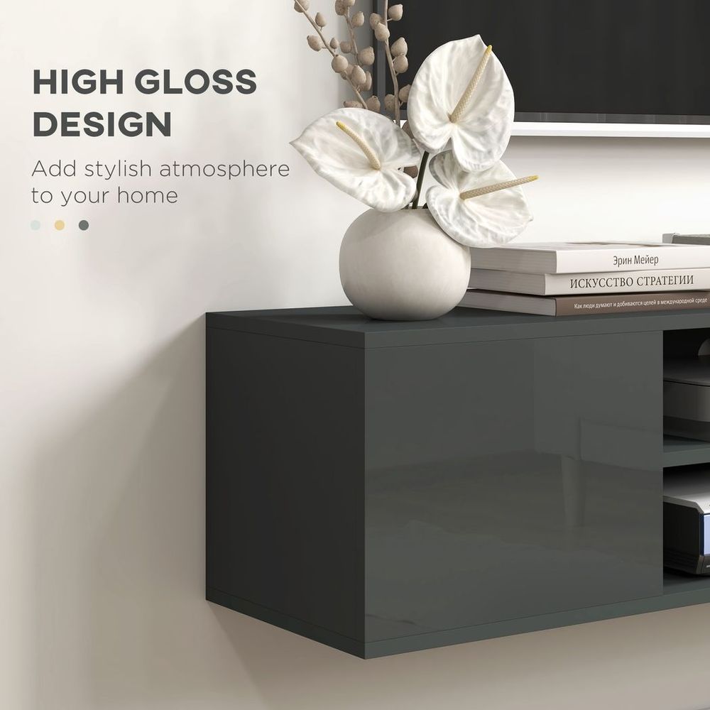 Smooth dark grey floating cabinet section with flat door panel for TV storage
