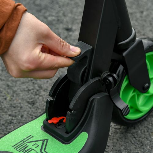 Green and black scooter deck with folding lever and hand pressing latch