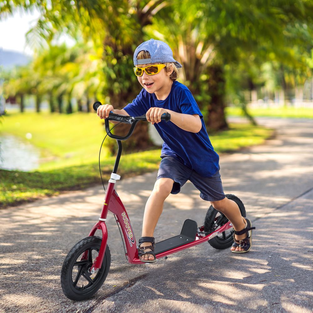 Red kids push scooter with black handlebars and large black wheels