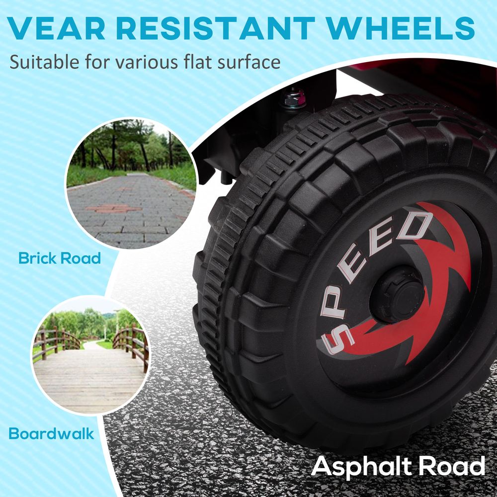 Large black tread wheel with red speed badge on pink ride-on