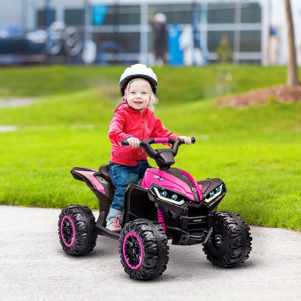 Pink kids electric quad bike with dual LED headlights and rugged wheels with pink rims