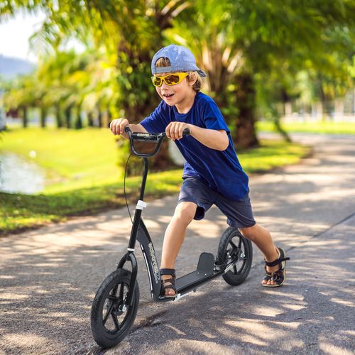 Kids kick scooter in motion with black frame, deck footboard, front wheel and handlebars