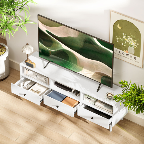 White low-profile TV stand with open compartments and drawers along the front