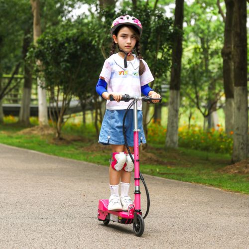 Kids electric scooter in pink with rider holding handlebars on a park path