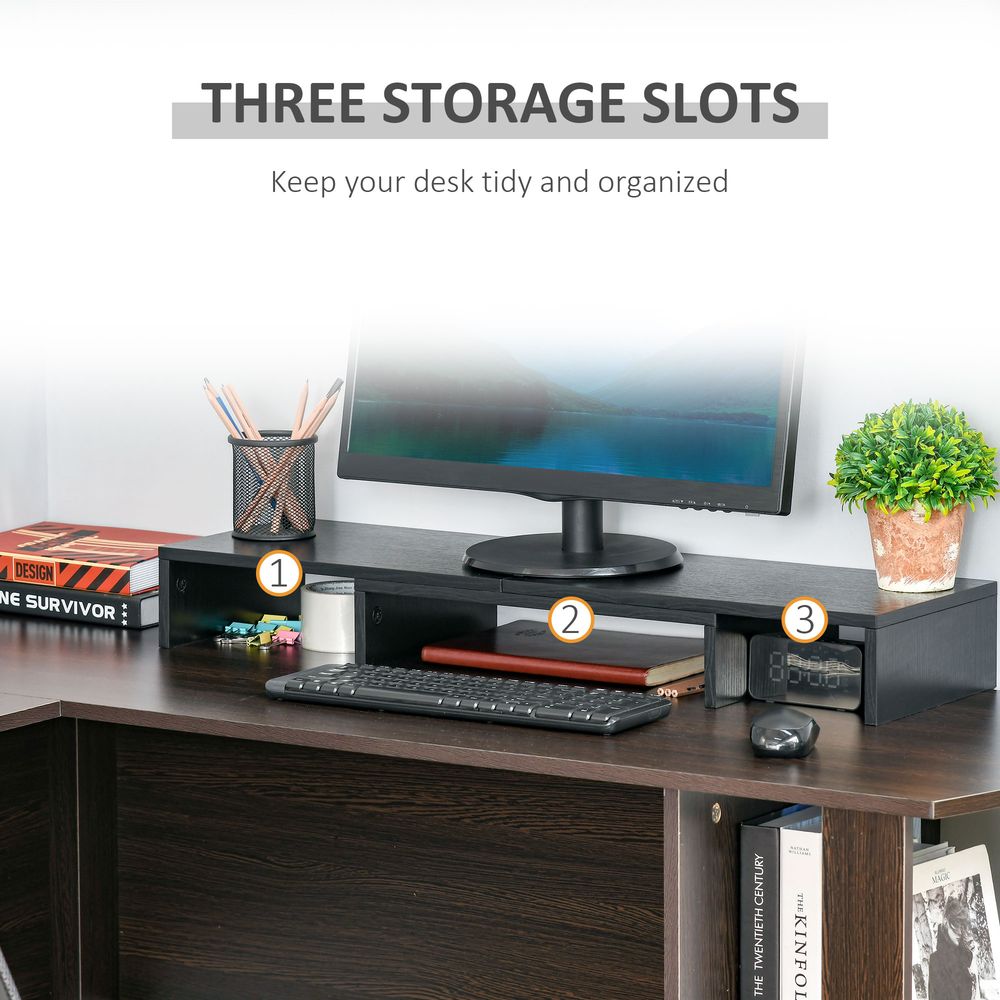 Black monitor stand riser with three storage slots for keyboard and small items, labeled