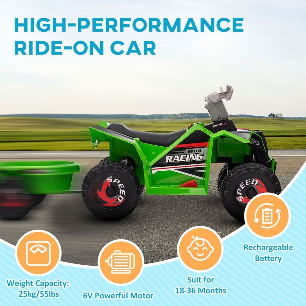 Green kids ride-on ATV with black seat, rear trailer, and four large rugged tires