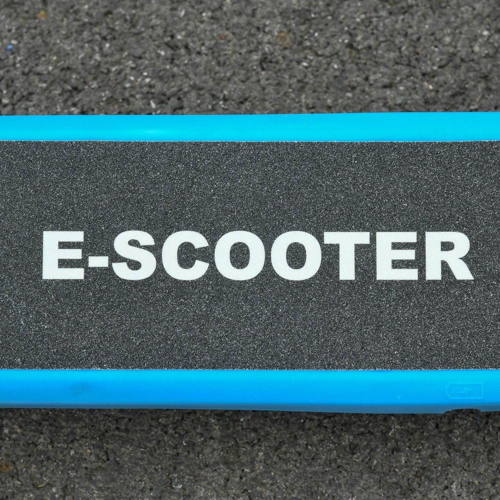 Blue scooter deck with “E-SCOOTER” text on black grip surface