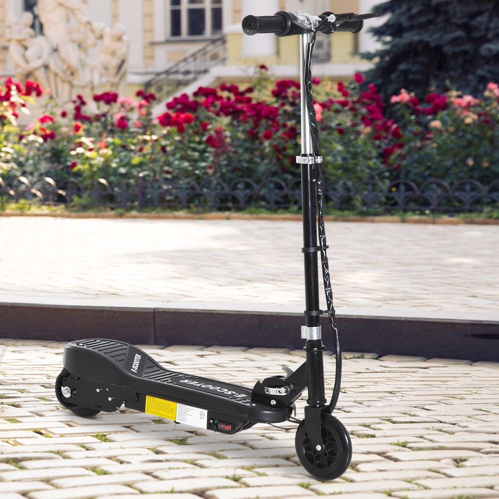 Black folding kids electric scooter with handlebar and front wheel on pavement