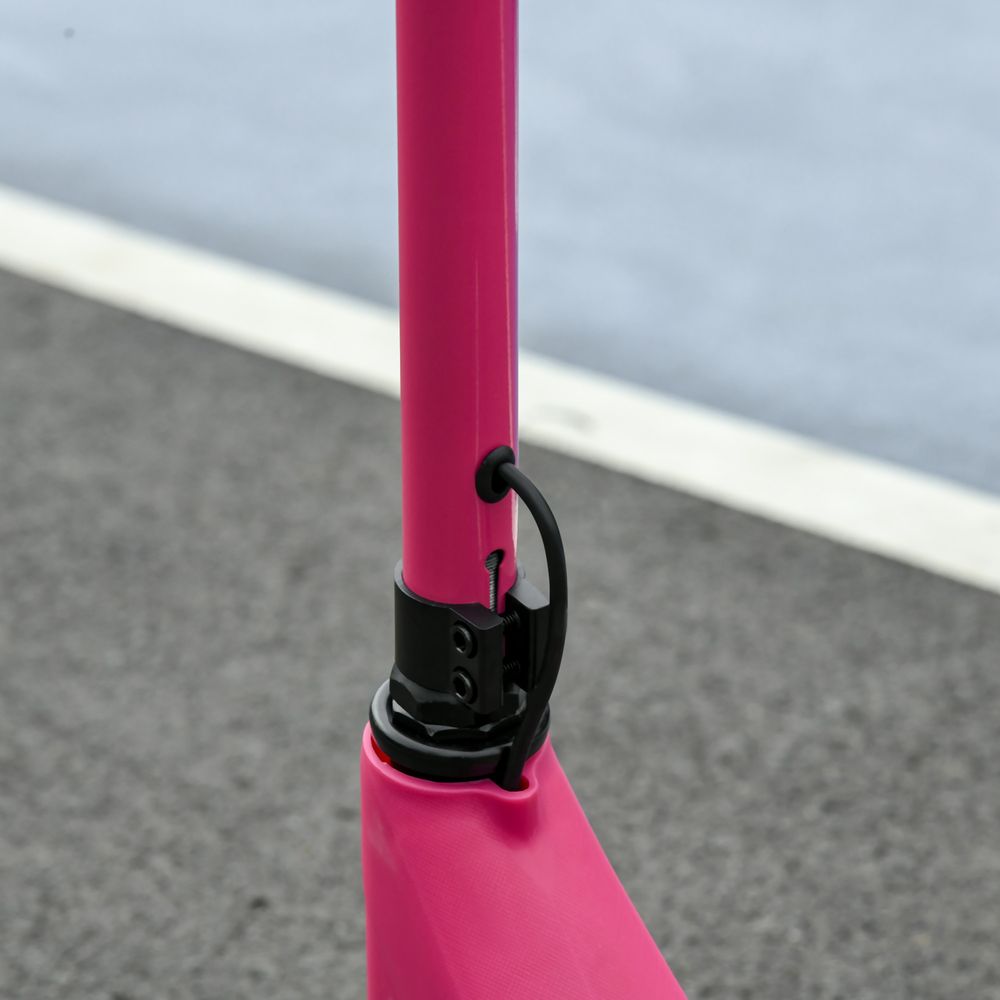 Pink electric scooter folding latch on the front stem, close-up