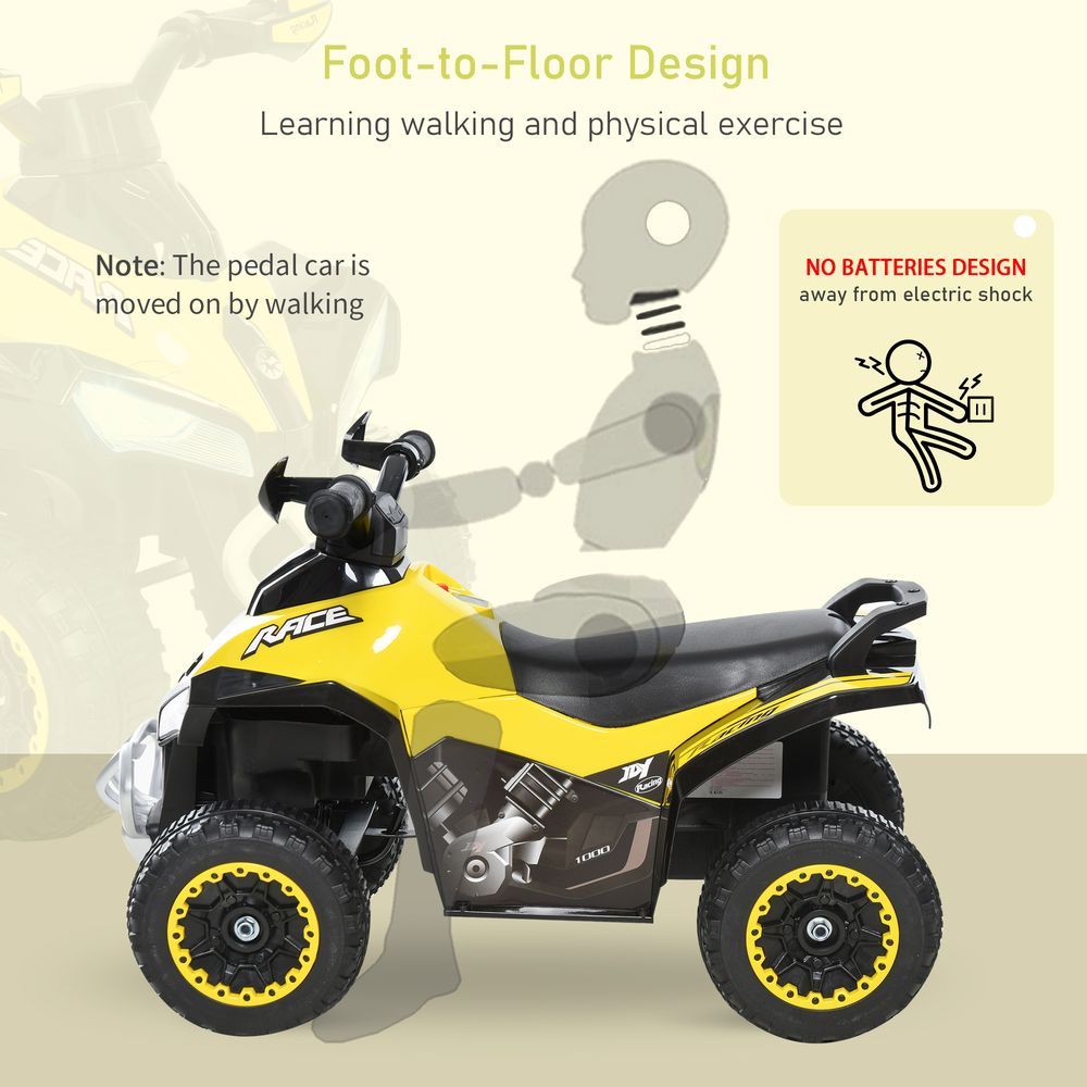 Yellow and black foot-to-floor toddler quad ride-on with black seat and front bumper
