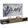 Grey floating TV media console with open shelves and central storage drawer