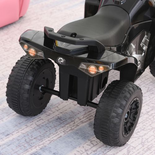 Black toddler ride-on quad car with front light pods and front bumper
