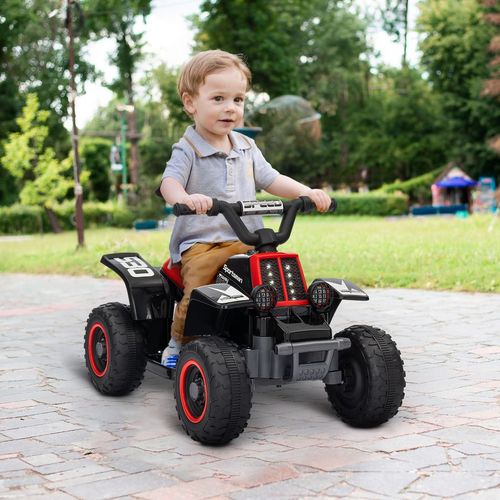 Child riding a kids electric quad bike, black frame with red seat and four tires