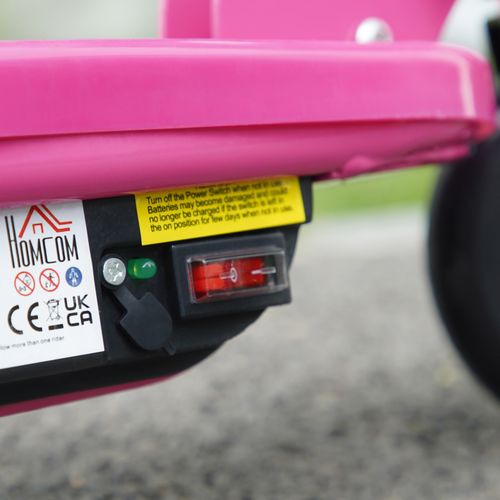Close-up of the control panel and indicator lights on a pink electric scooter