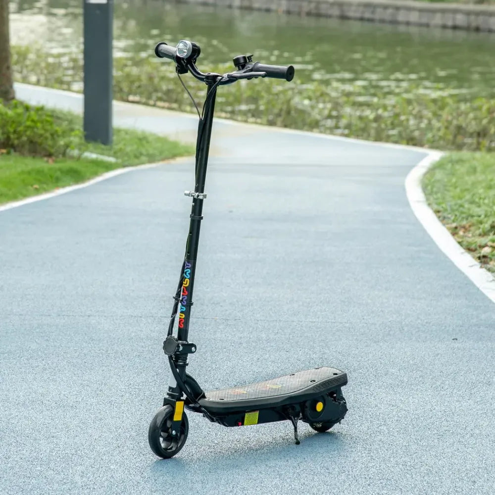 Black folding electric scooter with front LED headlight and textured foot deck