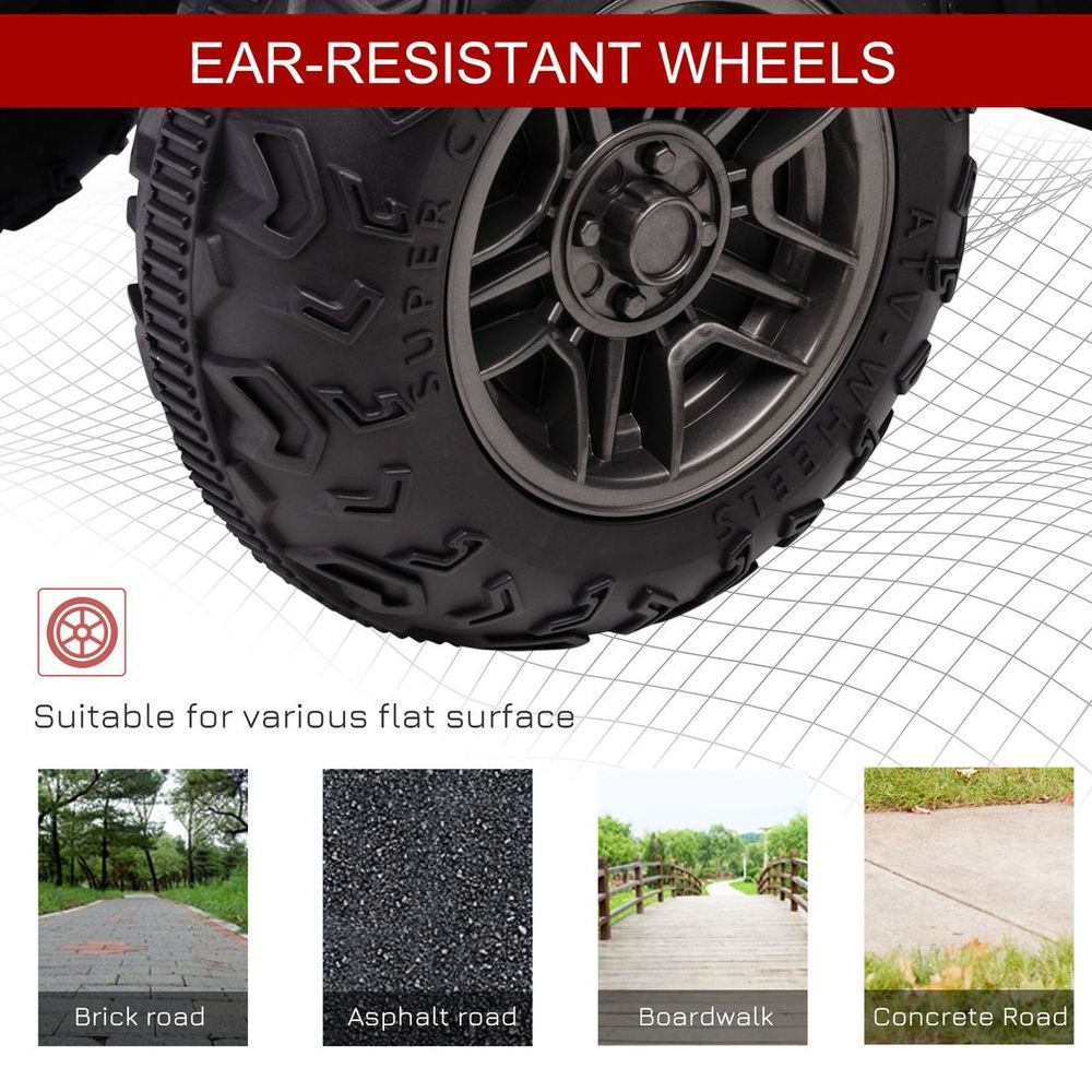 Front wheel of white and black kids electric quad bike with rugged all-terrain tire