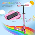 Kids pink scooter with LED wheels and control switch on the deck