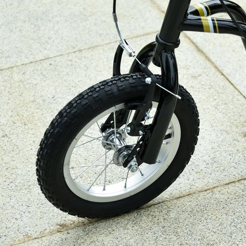 Black kids stunt scooter front tire with knobby tread and silver spokes