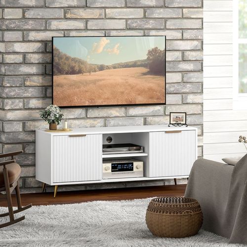 White TV stand cabinet with ribbed door panels and open center shelf for a media player