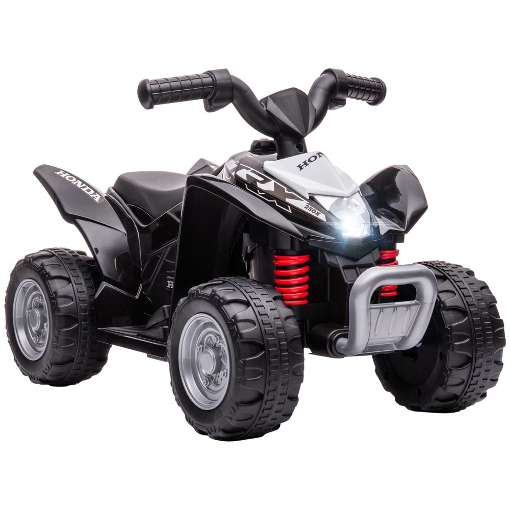 Black kids electric quad bike with front headlights, thick tires, and red shock springs