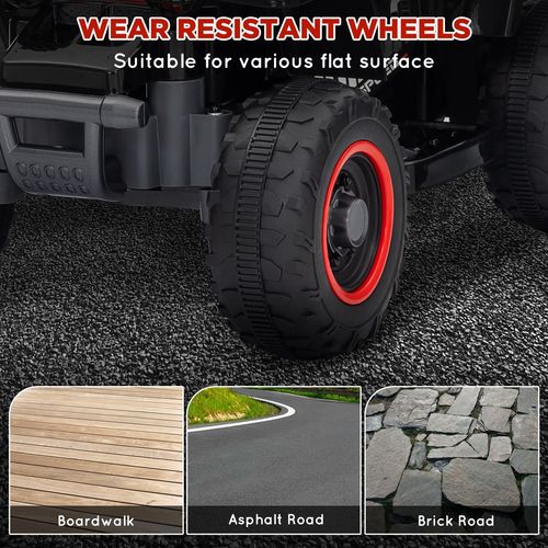 Quad bike wheels close-up: black tread tires with red rims for traction
