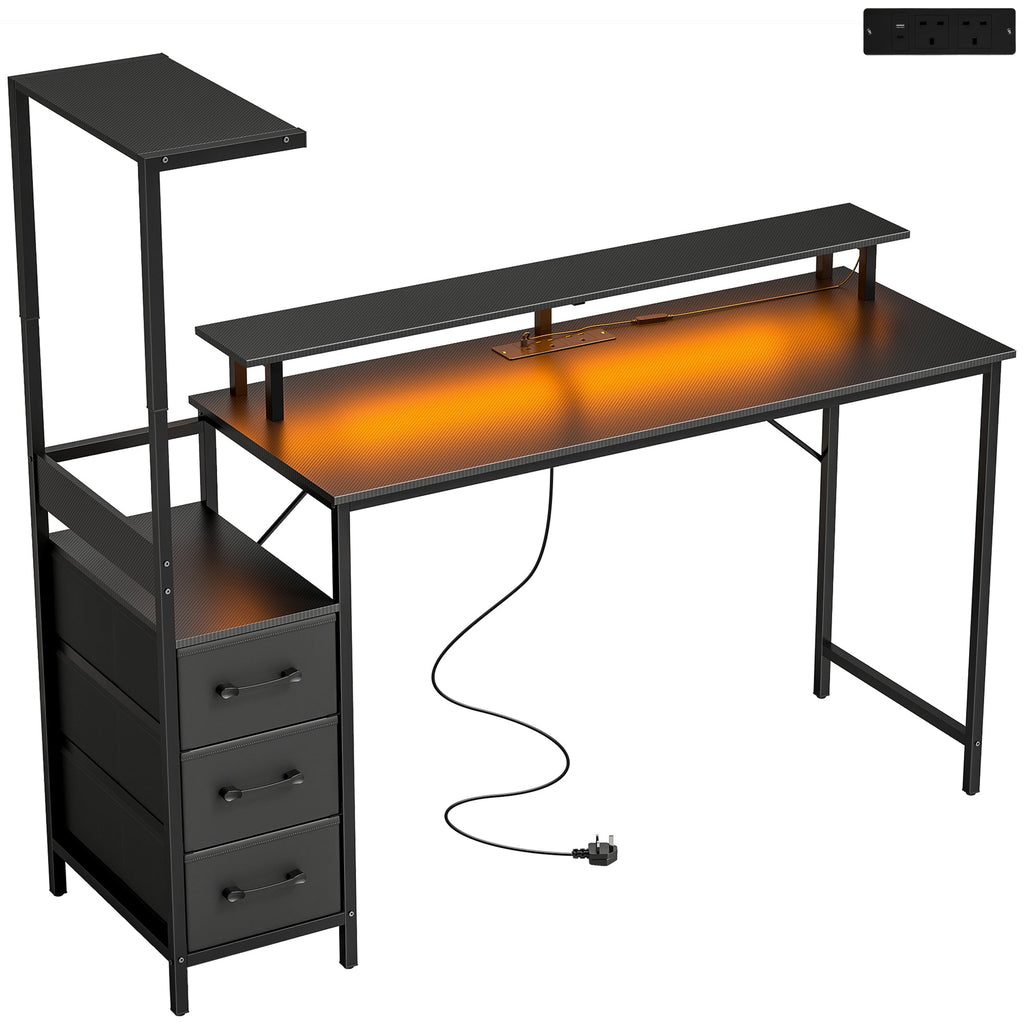 Black gaming desk with monitor stand, keyboard tray, and cable management grommet