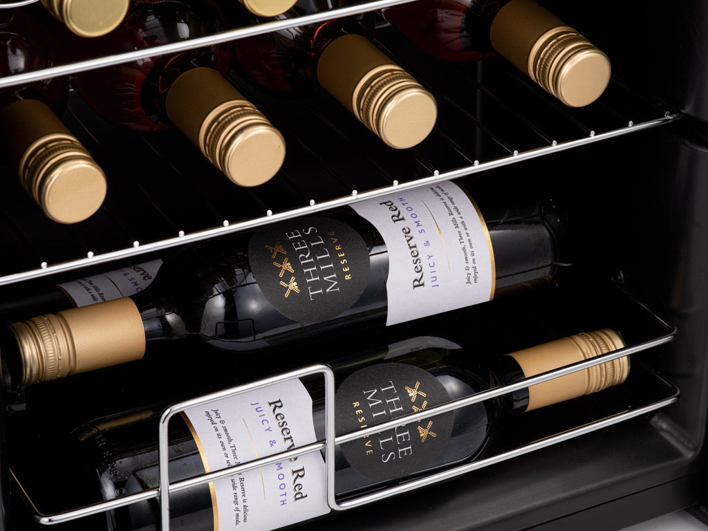 LED-lit wine cooler shelf holding red wine bottles with front-facing labels