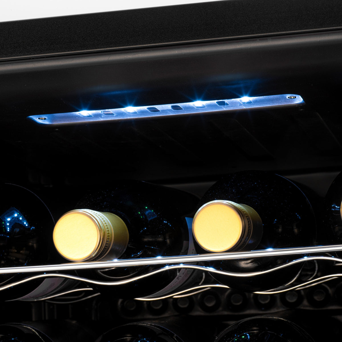 Blue LED light bar inside wine cooler illuminating bottle tops