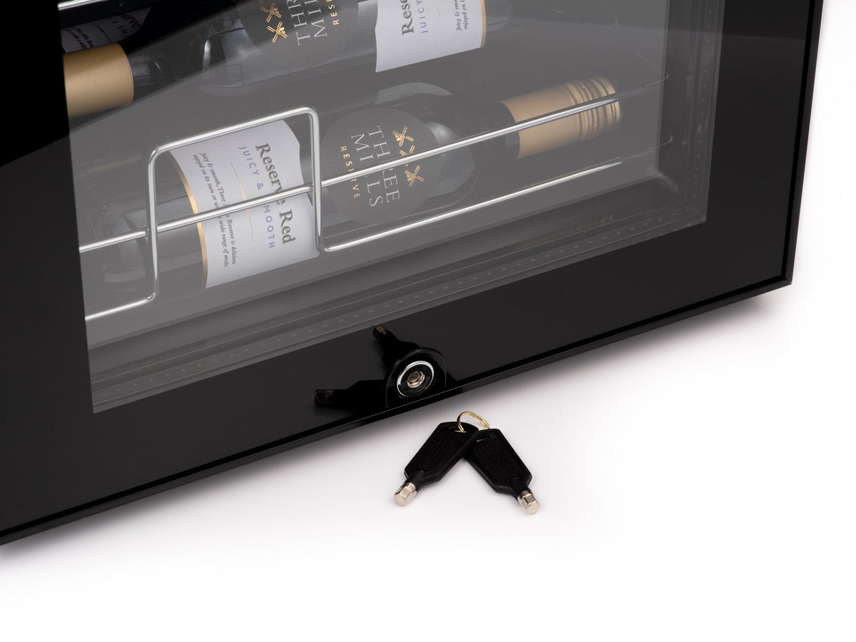 LED wine cooler with open door and included power keys on white background