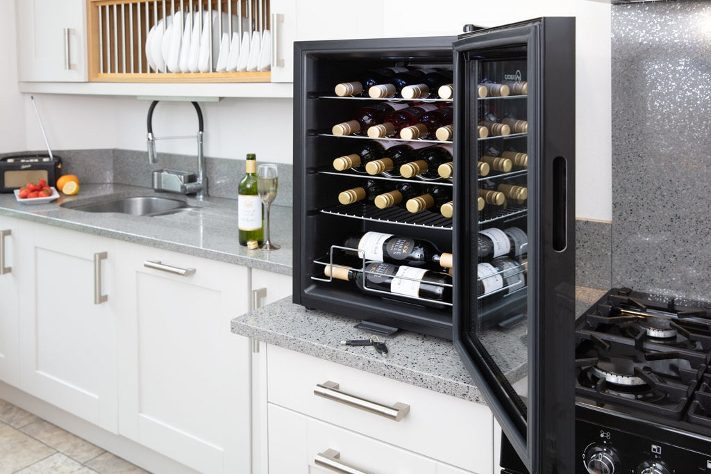 Black wine cooler with bottles on interior wire racks behind a glass door