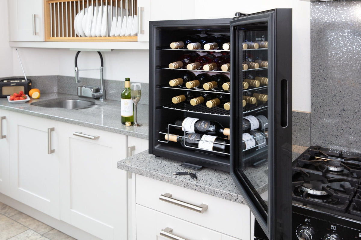 Black wine cooler with bottles on interior wire racks behind a glass door