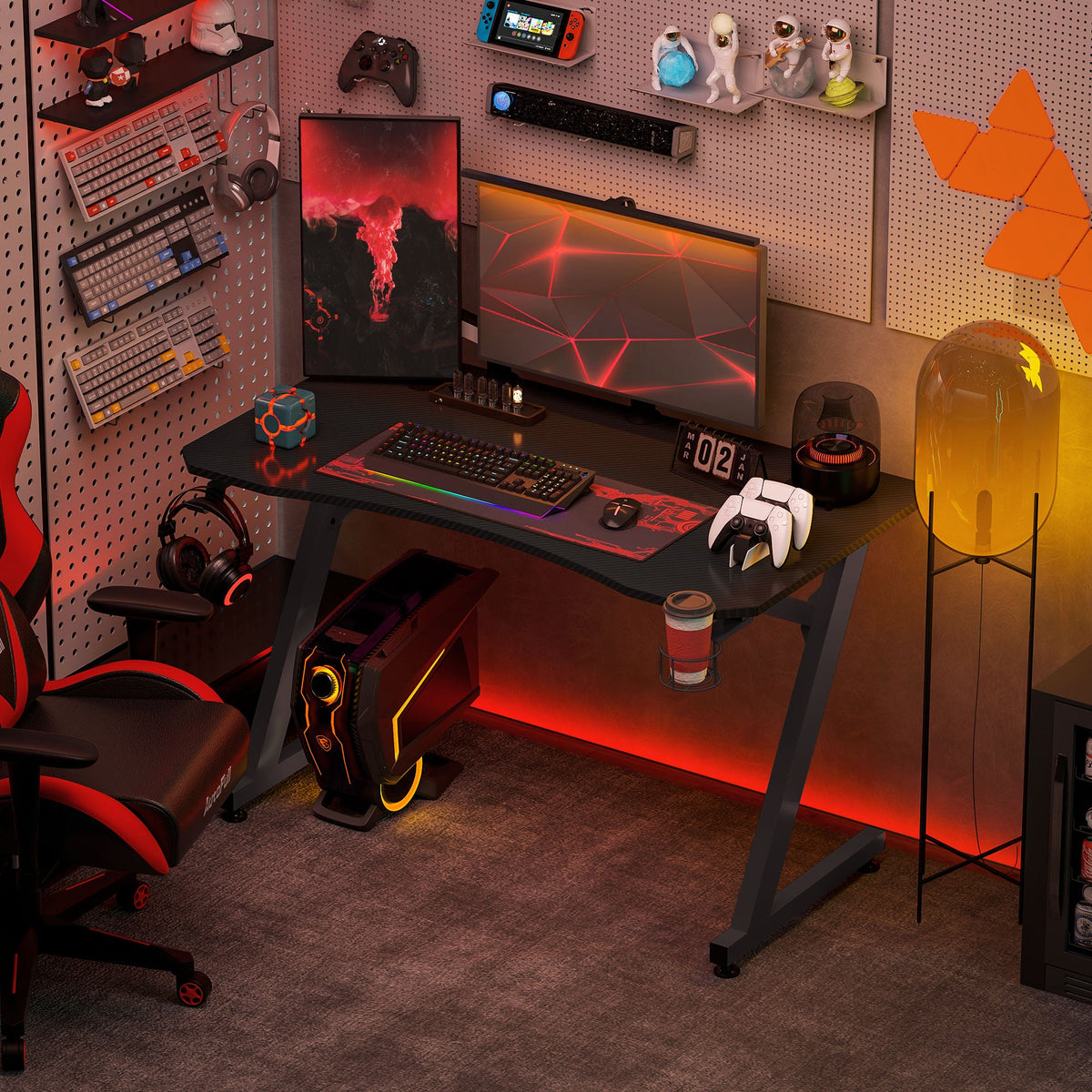 Black gaming desk with keyboard and monitor platform, cup holder, and headphone hook