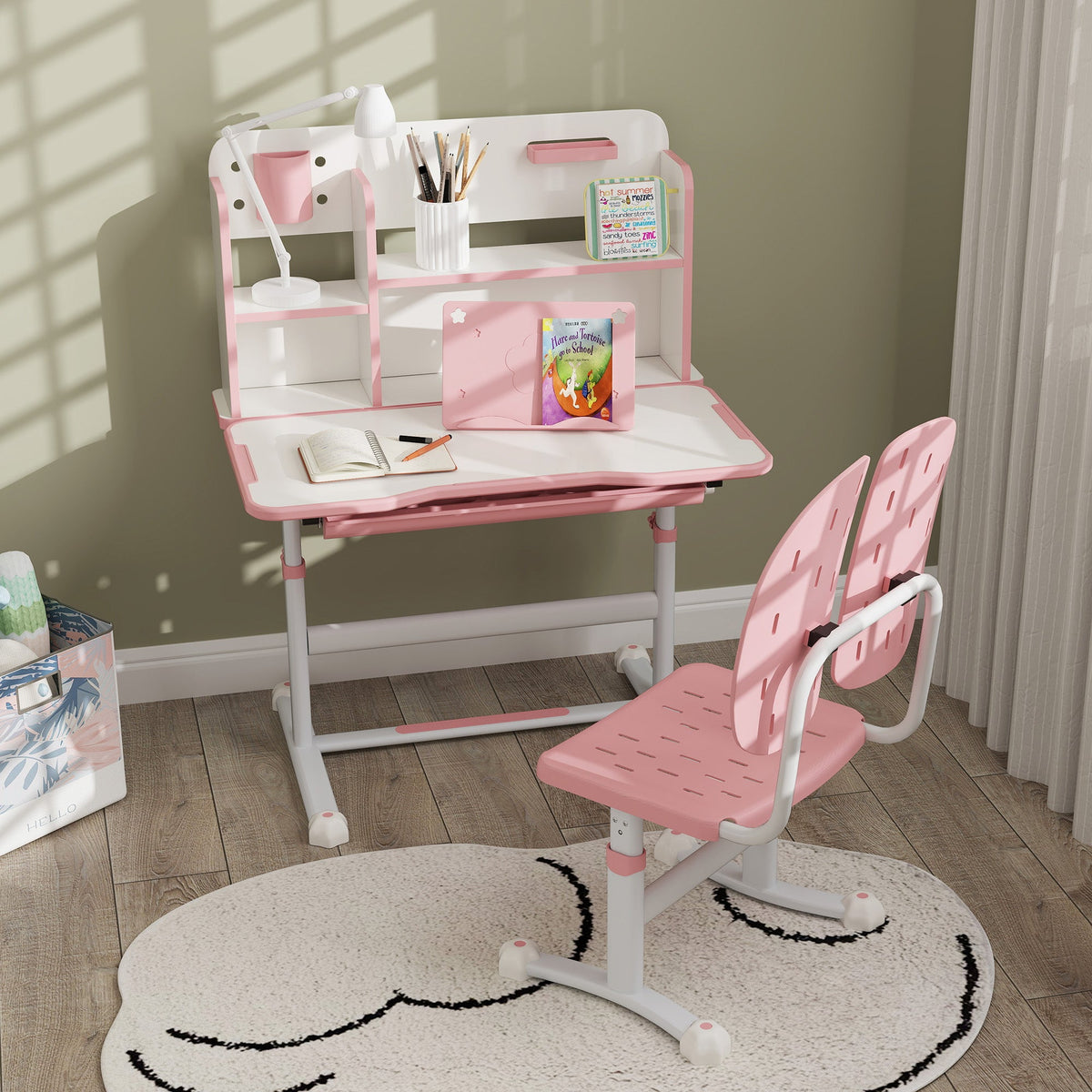 Pink kids desk set with reading rack and pull-out drawer, matching chair with footrest